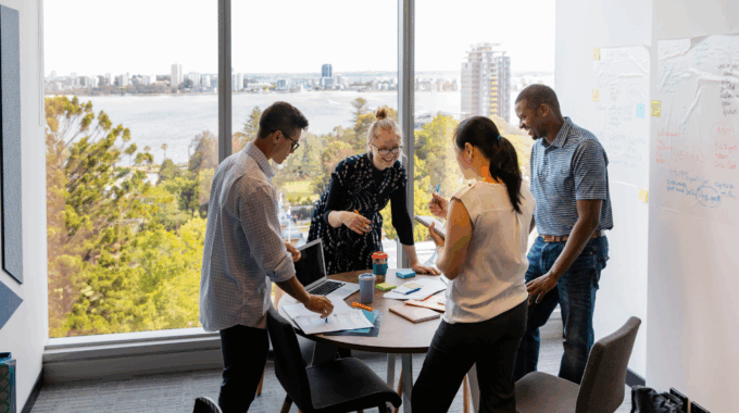 Small Marketing Team Collaborating On Brand Promotion